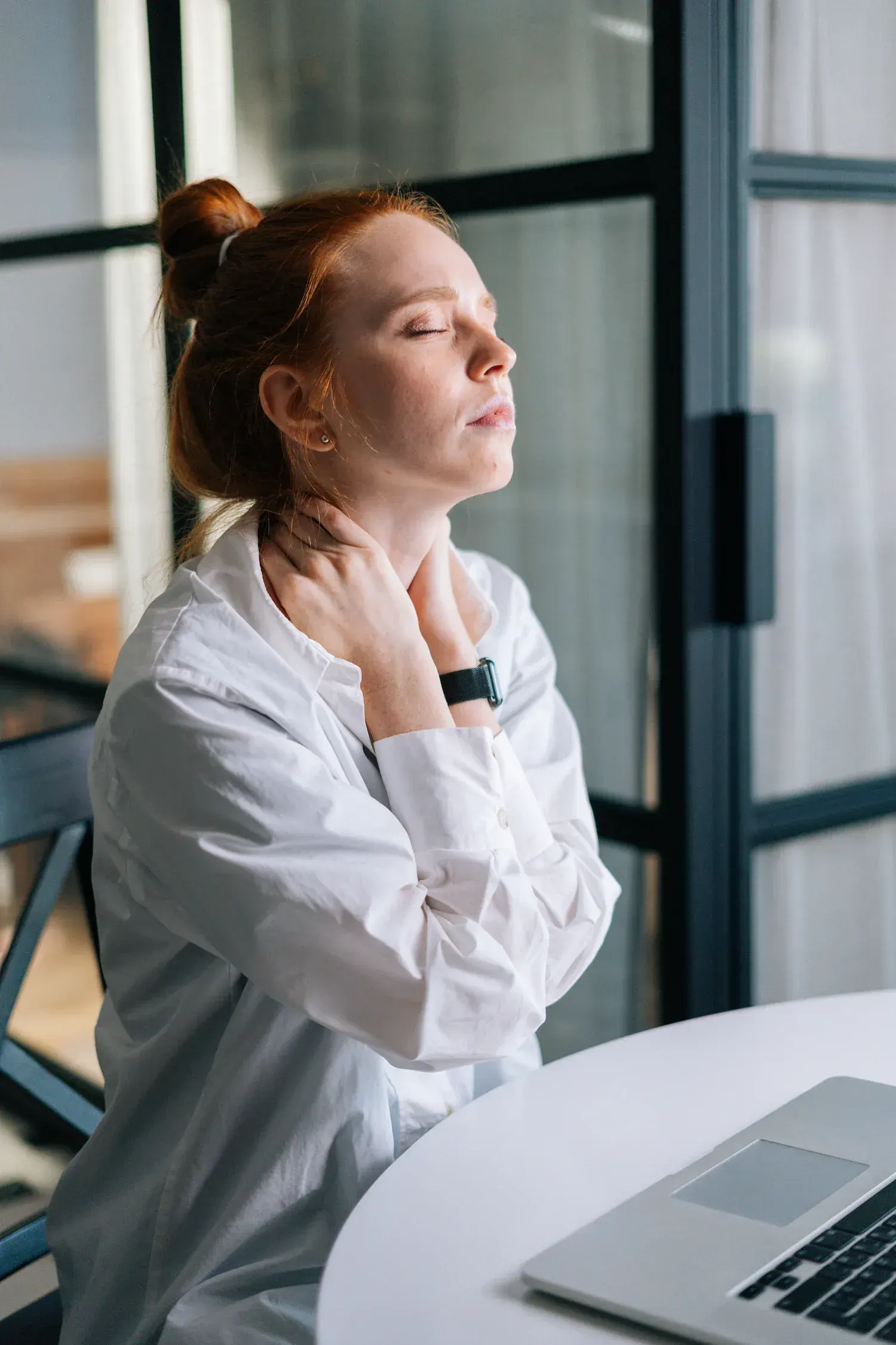 Person concerned about chronic pain symptoms seeking help at Arise Integrative Wellness Port Charlotte