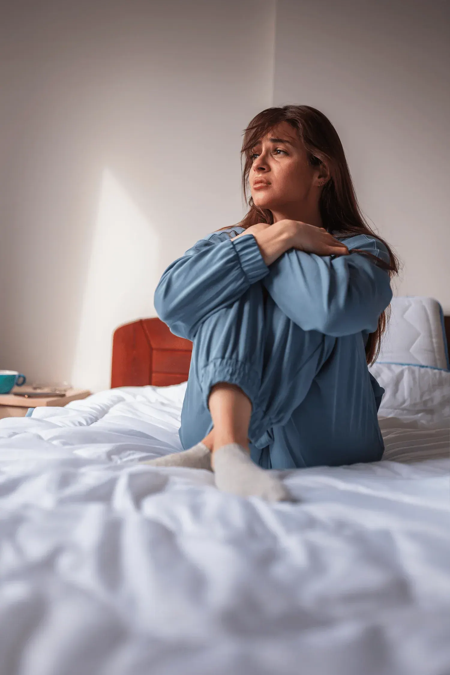 Person concerned about anxiety symptoms at Arise Integrative Wellness