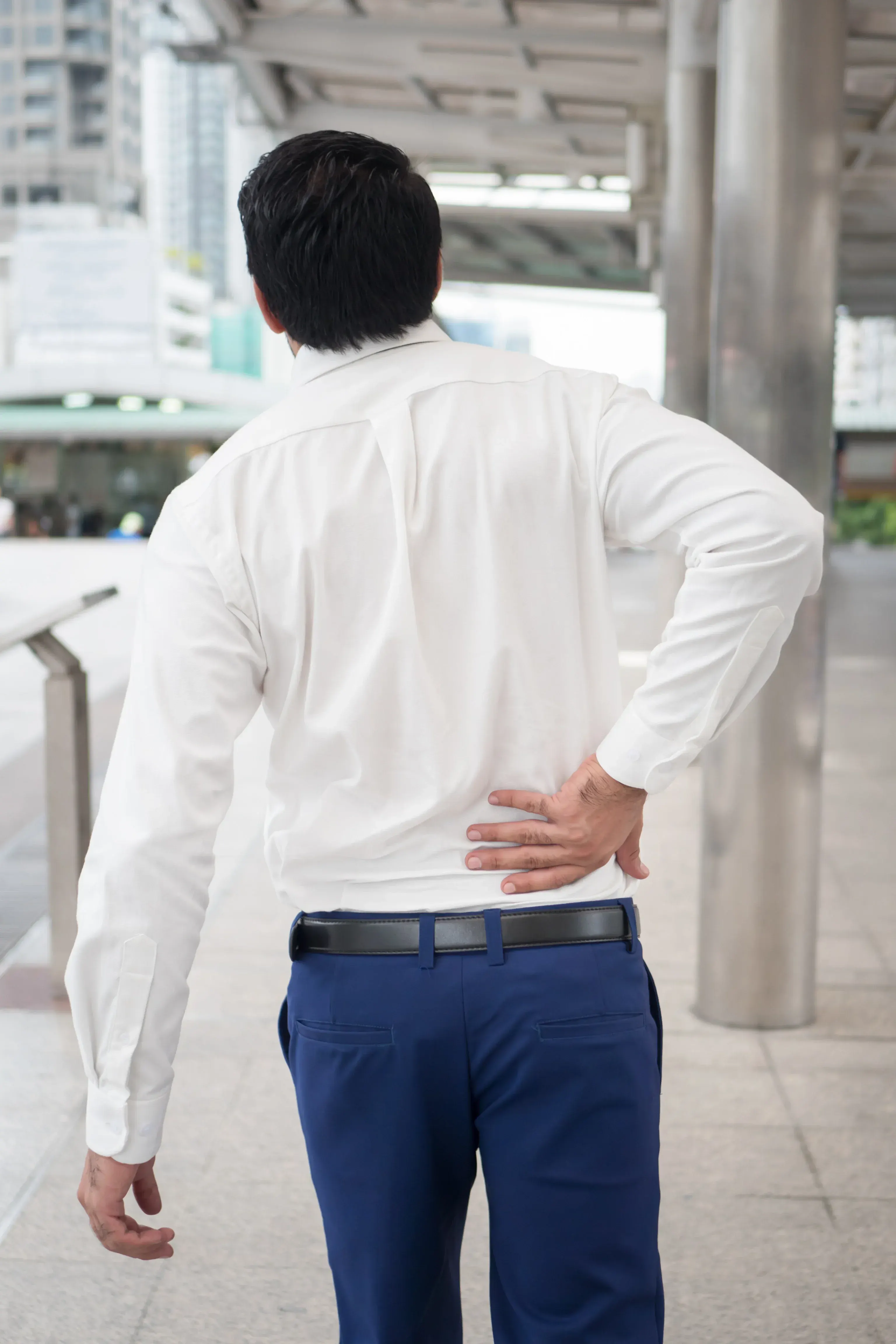 Person concerned about back pain at Arise Integrative Wellness Port Charlotte