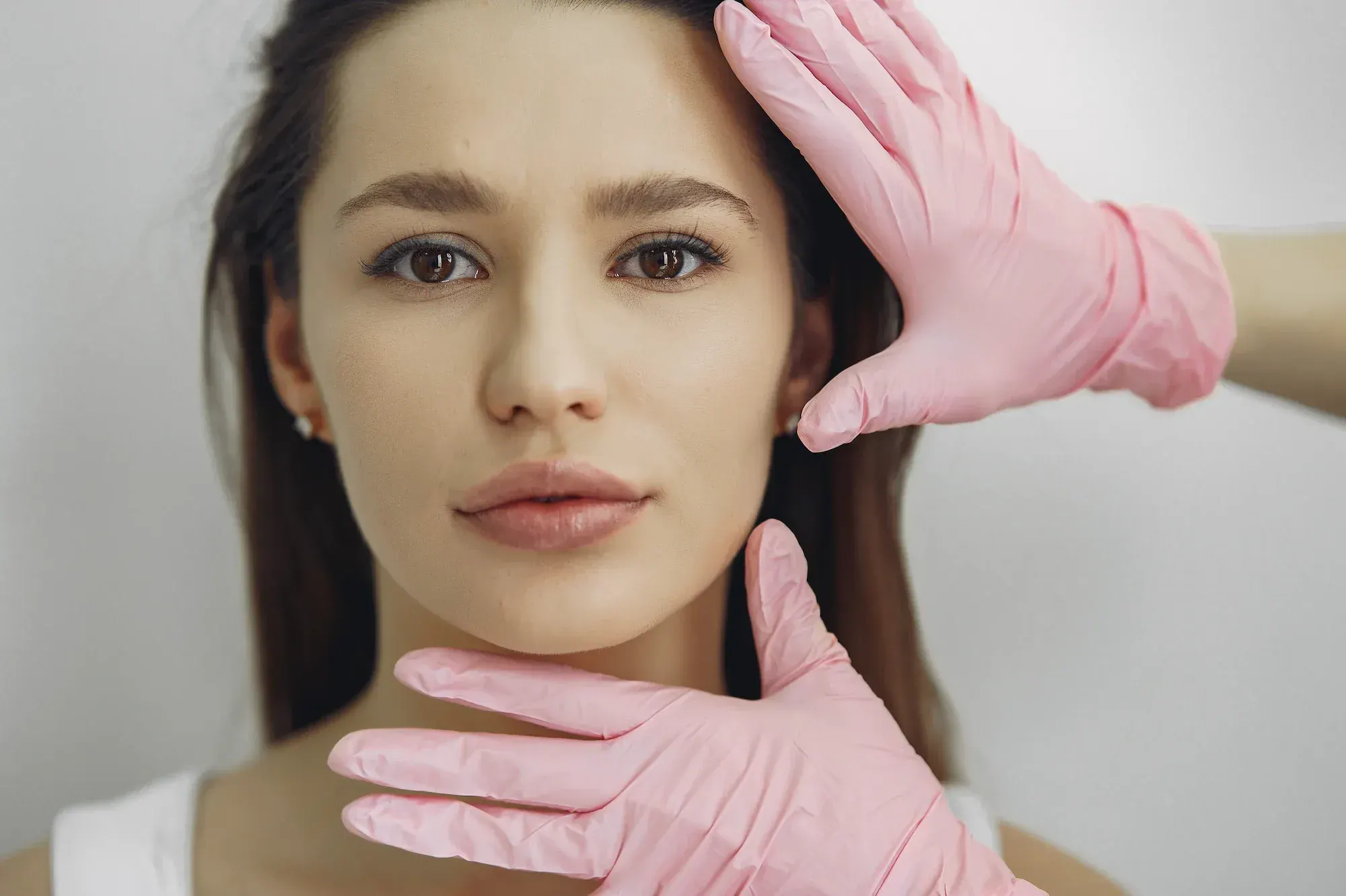 Woman addressing skin tightening concerns at Arise Integrative Wellness Port Charlotte